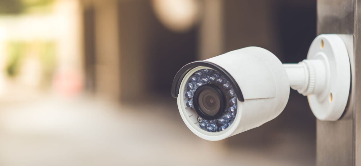 White cctv outside the building, security system